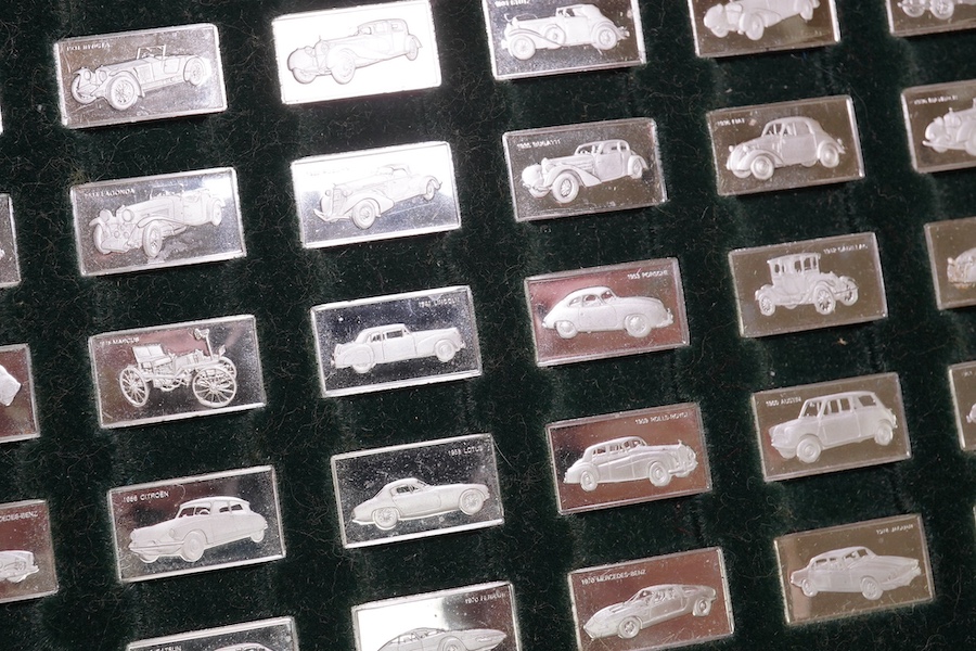 A cased set of one hundred 925 ingots, each depicting a different car model, each 27mm and weighing approximately 1.6 grams. Condition - good